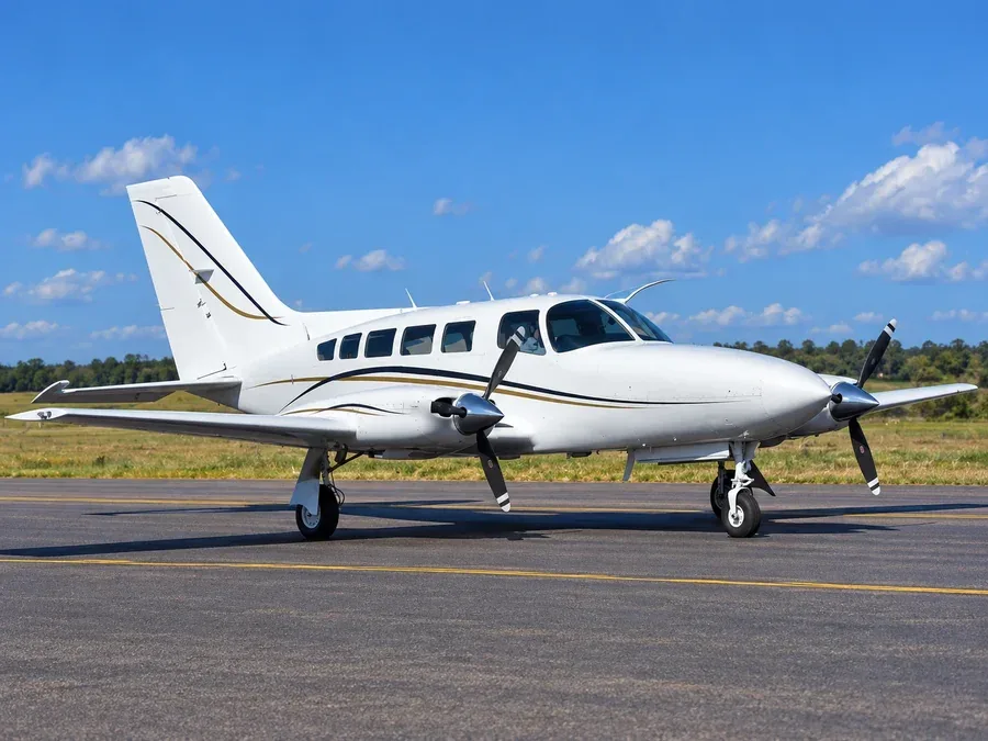A Cessna 402C twin piston plane on the ramp